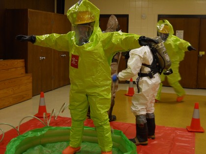 Fire Department Hazardous Material Training - wearing yellow hazard suit