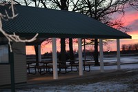 Park Scene with covered picnic table in sunset